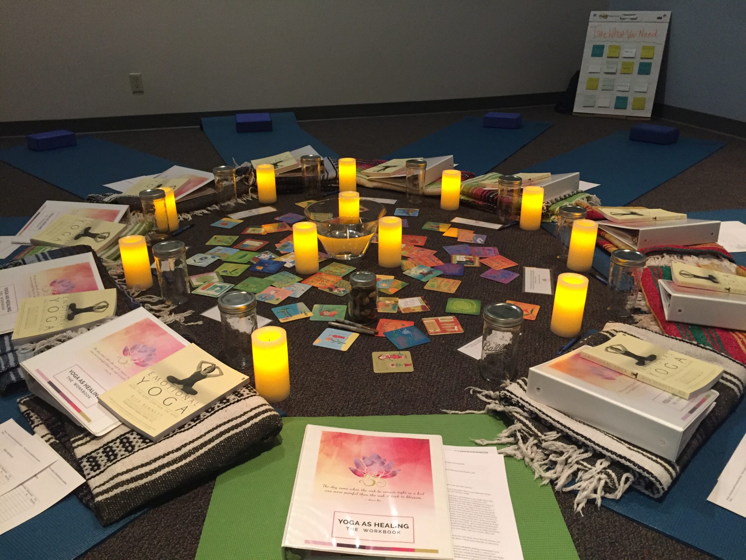 candles with blankets and guidebooks in a circle